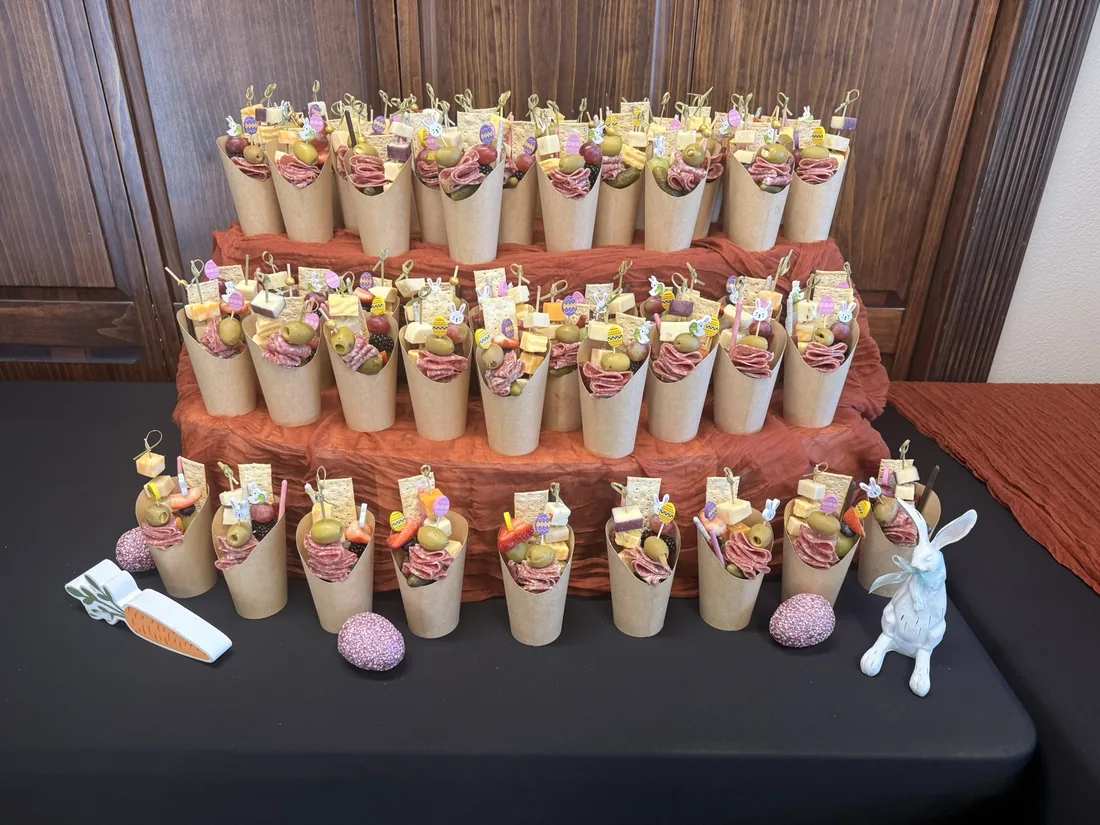 Individual charcuterie cups on a tiered stand